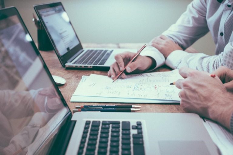 Two professionals discussing the potential of AI integration tools in enhancing customer experience.